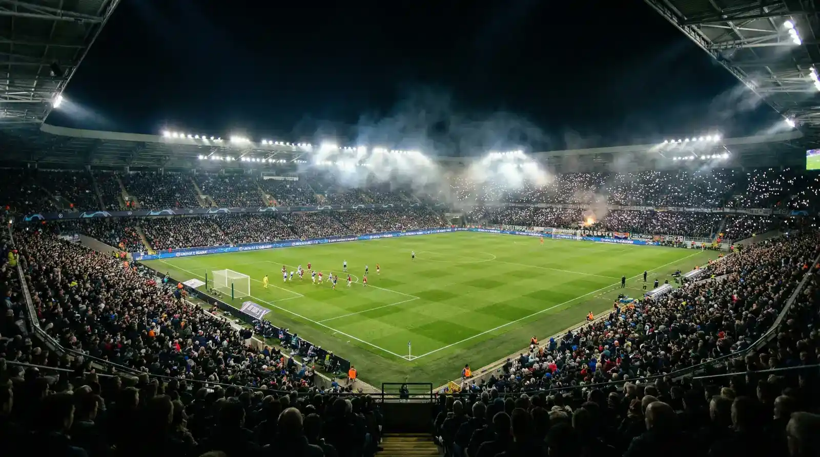 Pessoa a acompanhar jogo de futebol da Champions League num ecrã com dados de apostas em tempo real